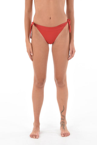 slip bikini a tinta unita con laccetti laterali