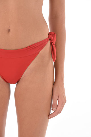 slip bikini a tinta unita con laccetti laterali