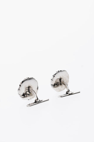 brass cufflinks with skulls