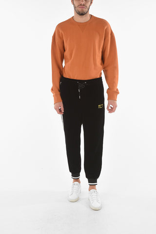 Joggers in velour con banda laterale a contrasto