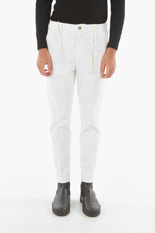 Pantaloni MITTE a una pince con elastico in vita