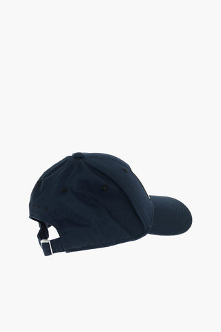 Cotton gabardine cap with contrast embroidered “M” patch on the front