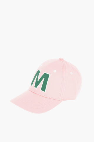 Cotton gabardine cap with contrast embroidered “M” patch on the front