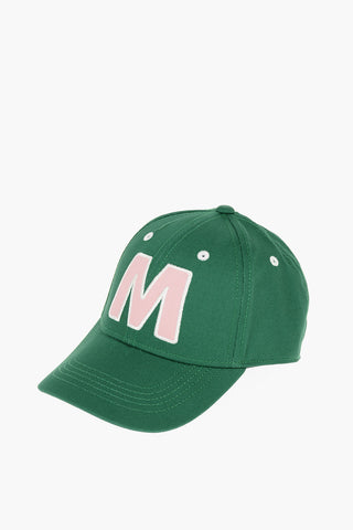Cotton gabardine cap with contrast embroidered “M” patch on the front