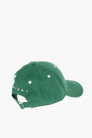 Cotton gabardine cap with contrast embroidered “M” patch on the front