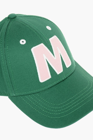 Cotton gabardine cap with contrast embroidered “M” patch on the front