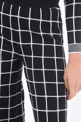 Pantaloni Flare in Jersey a Quadri Windowpane con Orlo Smerlato