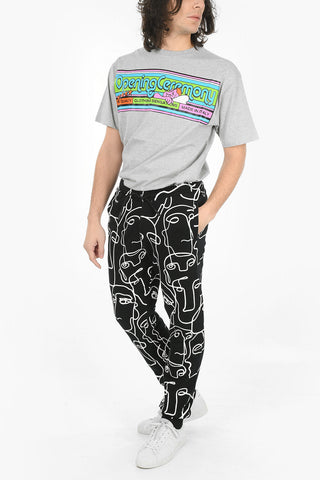 Joggers ALL OVER FACES in Cotone Garzato