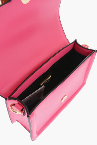 JEANS COUTURE Faux leather bag Embellished with Maxi Golden Buckle and Braided Handle