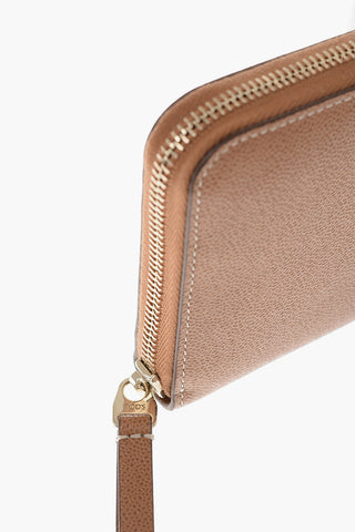 Leather wallet with gold logo tag