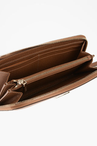 Leather wallet with gold logo tag