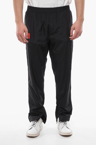 Solid Color Track Pants with Contrasting Details and Ankle Zip