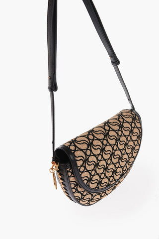 All-Over S-Wave Motif Fabric and Faux Leather Saddle Bag