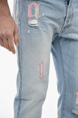 Jeans Distressed a Lavaggio Chiaro con Toppe