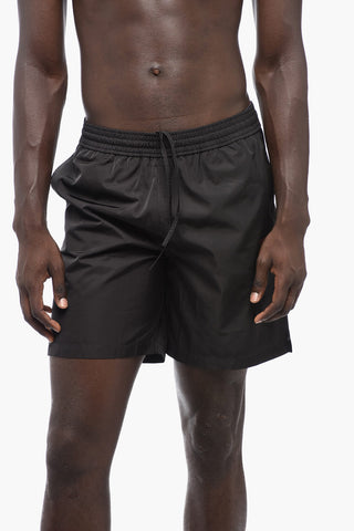 Solid Color MOON TAB Swim Shorts with Contrasting Print