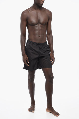 Solid Color MOON TAB Swim Shorts with Contrasting Print