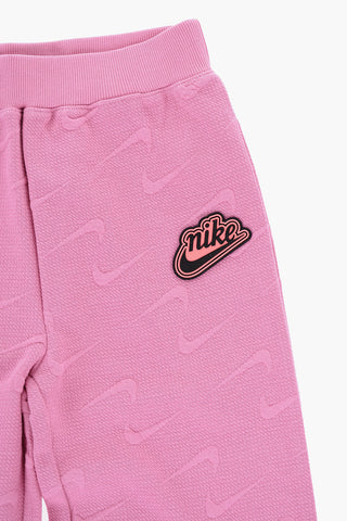 Einfarbige ausgestellte Hose mit Allover-Logo
