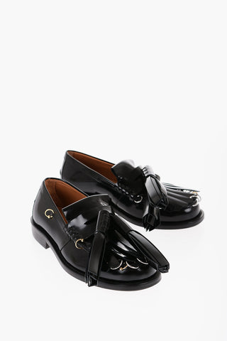 Mocassini Kiltie in Pelle Spazzolata con Maxi Nappine e Dettagli Piercing 