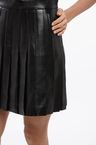 Minigonna Plissè in Pelle con Zip Posteriore
