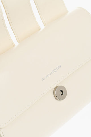 Leather THE SLASH Bag with Chain Shoulder Strap and Decorative Ring Handle