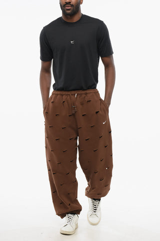 JACQUEMUS Solid Color SWOOSH Joggers with All-Over Cut-Out Details