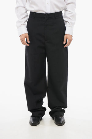 Vier-Taschen-Hose aus Wolle mit Satin-Seitenstreifen