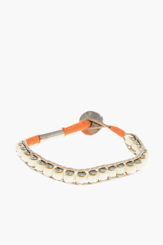 Armband aus Metall und Baumwolle