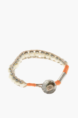 Armband aus Metall und Baumwolle