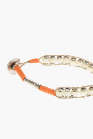 Armband aus Metall und Baumwolle