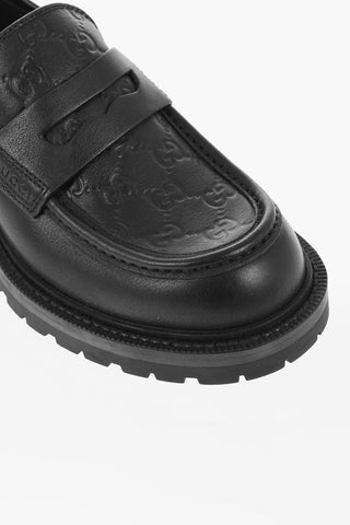 Embossed Leather Penny Loafers with Monogram Motif