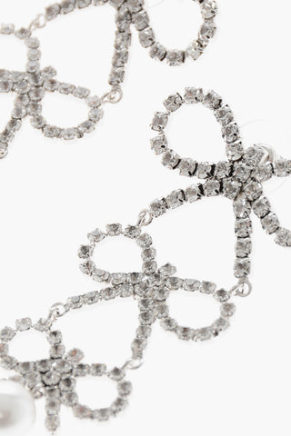 Dangling Rhinestone Earrings with a Triple Bow Design