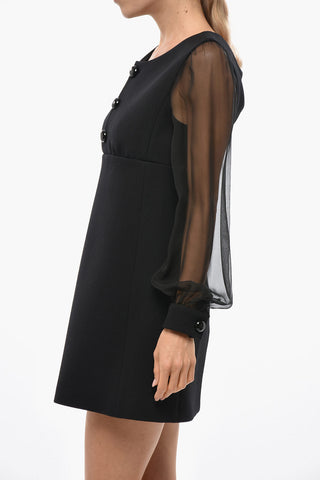 Rückenfreies Etuikleid aus Schurwolle mit transparenten Ärmeln