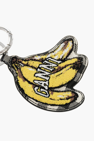 Schlüsselanhänger im Pied-de-Poule-Muster mit erhabenem Bananendetail