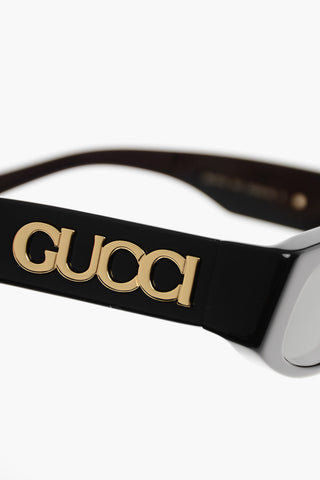 Ovale Sonnenbrille mit Maxi-Logo in Relief