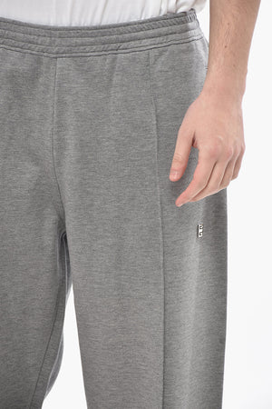 Jogginghose aus Stretch-Baumwolle mit vorderen Bundfalten und Bündchen