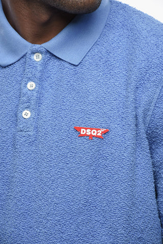 Polo aus Baumwollfrottee mit Logo-Pin