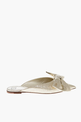 Lamé-Leder-Mules mit Maxi-Schleife