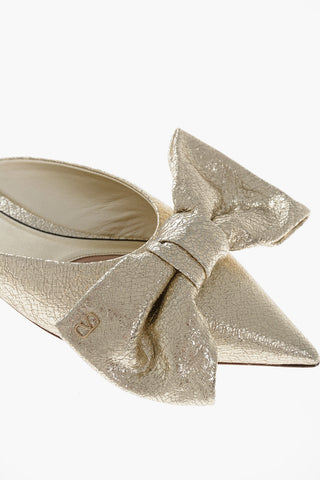 Lamé-Leder-Mules mit Maxi-Schleife