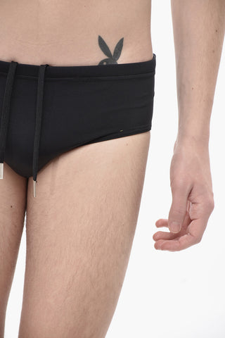 ICON Solid-Color Swim Brief with Contrasting Print