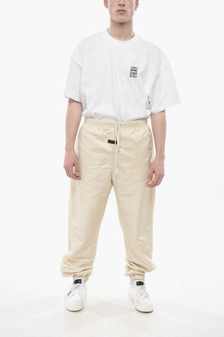 ESSENTIALS Pantaloni in Nylon a Tinta Unita con Zip alla Caviglia