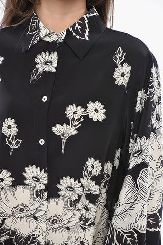 Seidenbluse mit Blumenmuster und seitlichen Drapierungen