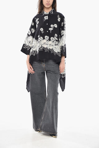 Seidenbluse mit Blumenmuster und seitlichen Drapierungen