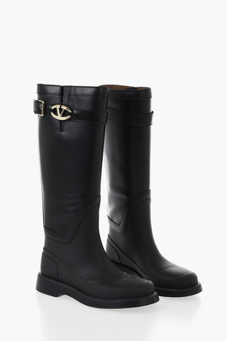 Leather and rubber boots with logo strap