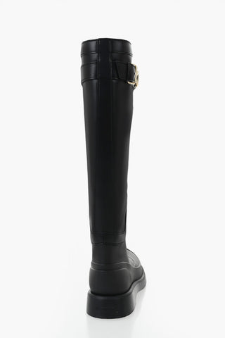 Leather and rubber boots with logo strap