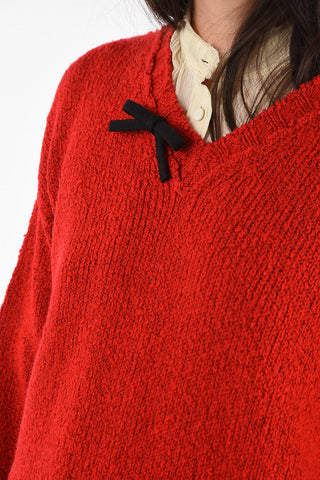 Oversized v-neck sweater with bow