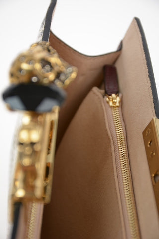 Snake printed FOUR RING Clutch