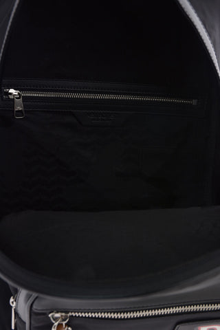 Fabric PIERCED MONOGRAM VARSITY Backpack with Leather Details