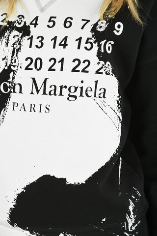 MM0 SPRAY-PAINTING EFFECT LOGO LOOPBACK SWEATSHIRT