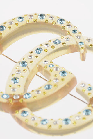 Spilla Logo con Strass