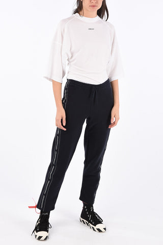pantalone jogger con bandala laterale logata
